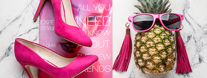pineapples as prestige - fashion items and a pineapple wearing sunglasses.