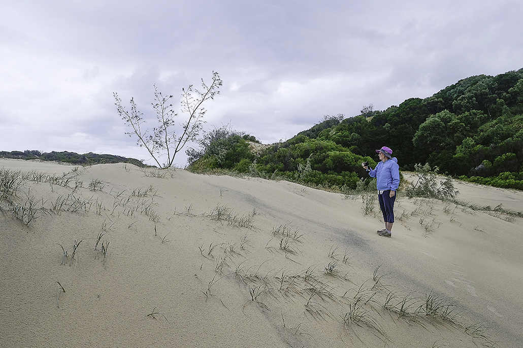 K'gari Cultural Tours - Woman at Waddy Point sand dunes