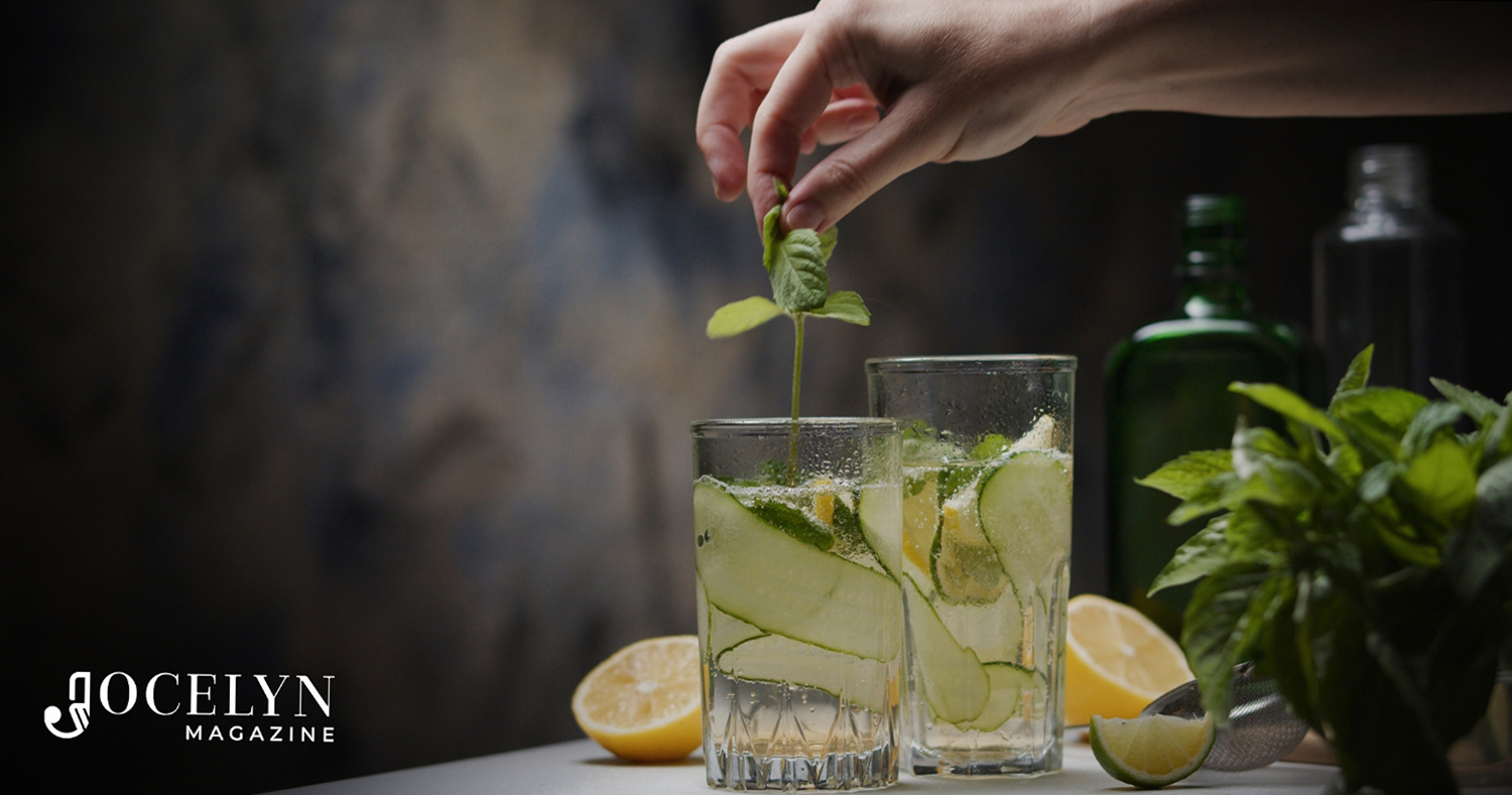Gin infusions - Hand placing botanical in glass of gin