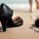 work-life balance - shoes on the beach and barefoot lady