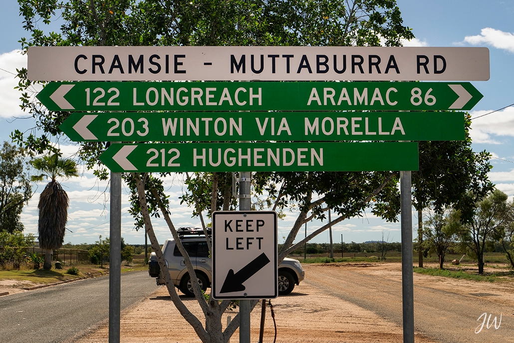 slow travel essentials Australia - Outback Queensland road trip directions sign