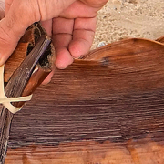 Fraser Coast arts: Hands weaving a traditional palm frond basket during a Butchulla cultural experience on K’gari (Fraser Island), part of the Fraser Coast’s arts and cultural heritage.