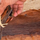 Fraser Coast arts: Hands weaving a traditional palm frond basket during a Butchulla cultural experience on K’gari (Fraser Island), part of the Fraser Coast’s arts and cultural heritage.