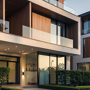 20260318-townhouse-living-body-corporate-australia-001 Townhouse Living: Modern townhouse complex exterior in Australia with landscaped gardens and balconies