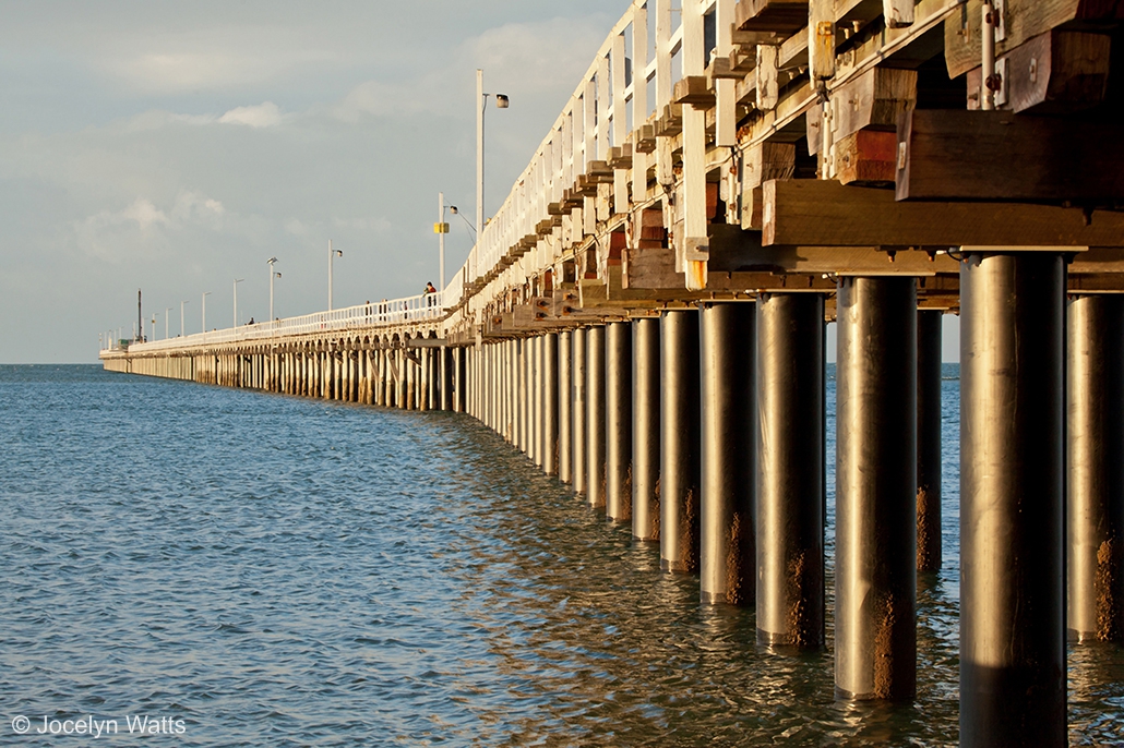 Urangan Pier stretching into the ocean with long pylons beneath