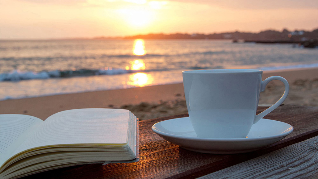 Coastal lifestyle Australia morning coffee by the beach at sunrise