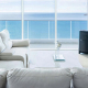 Coastal apartment living Australia with ocean view from modern living room.