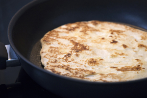 Eat with store-bought naan heating in a Tefal non-stick frypan with golden charred spots.