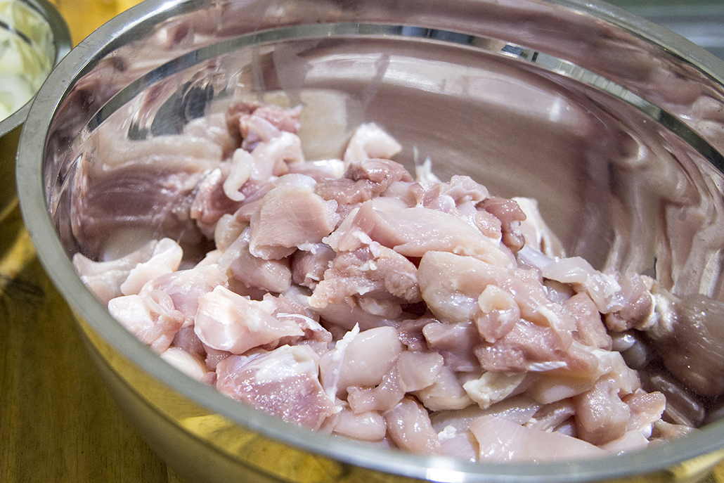 Slow-Cooked Indian Curry Recipe: Chicken thighs and chopped onion prepared for slow-cooked butter chicken.