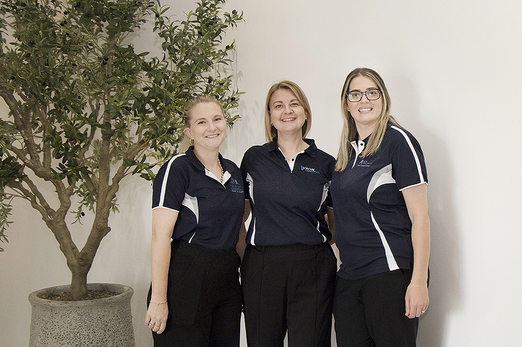 Win Projects staff Ashleigh Roberts, Bri McManus and Neisa Rasmussen at the reopening of The Place Urangan in Hervey Bay.